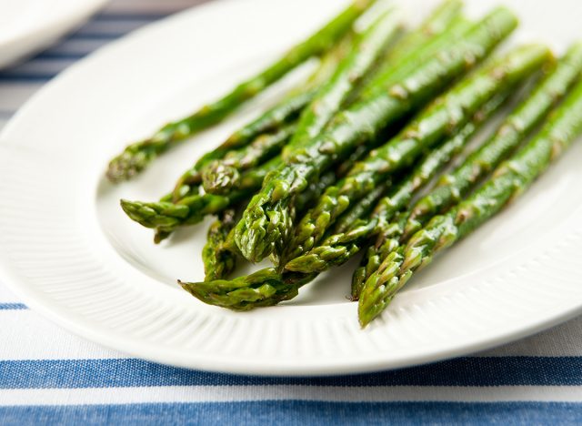 steamed asparagus on white plate