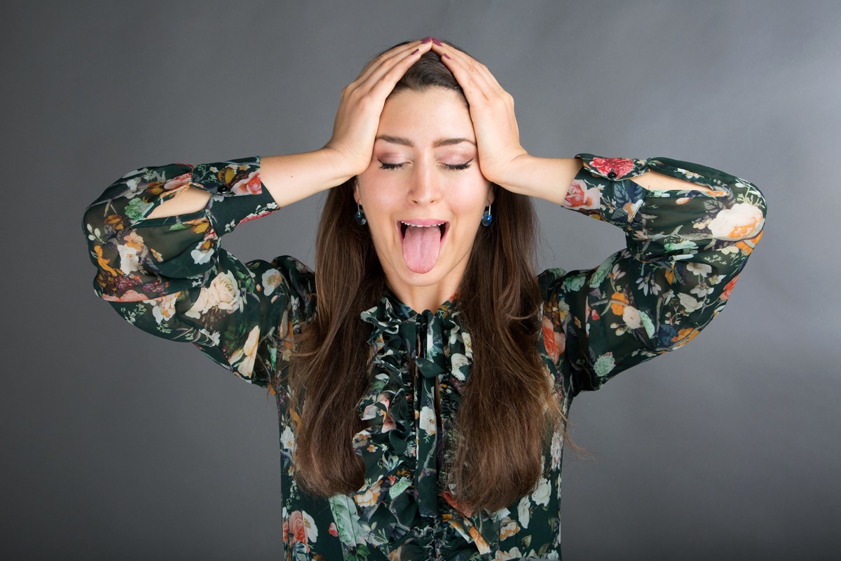 woman doing face yoga exercise