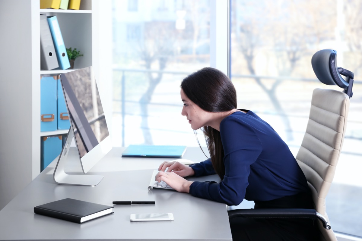 Young woman working with computer at office