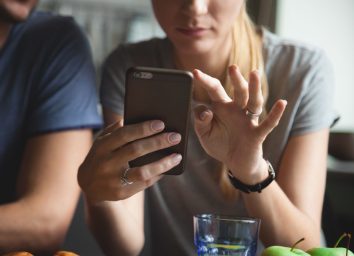 Woman tracking her calorie and food intake on app on phone