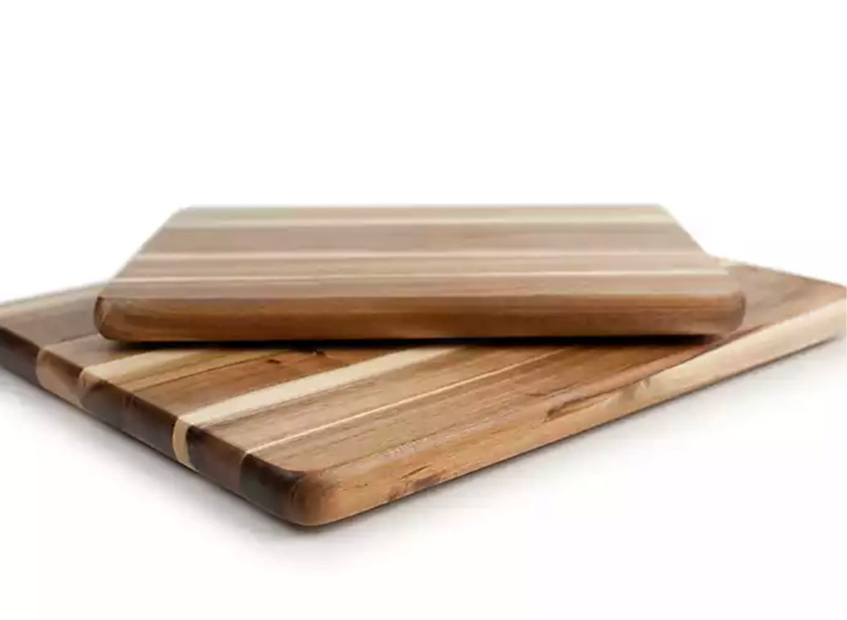 two wooden cutting boards on white background