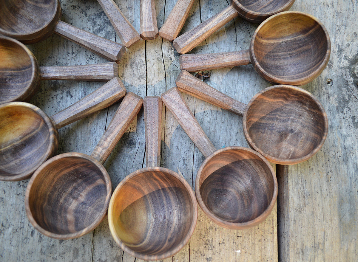 wooden spoons in circle shape on wooden background