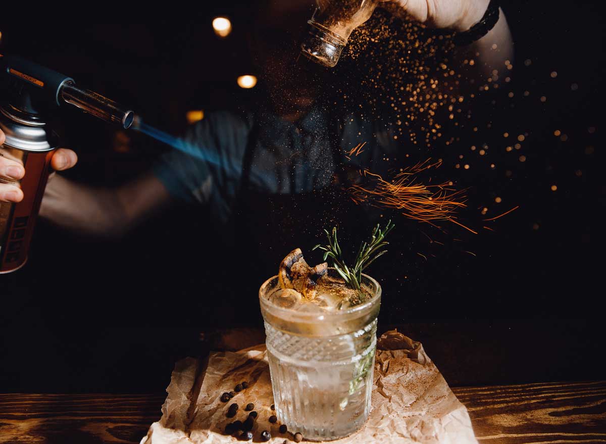 Culinary cocktails with blow torch herb