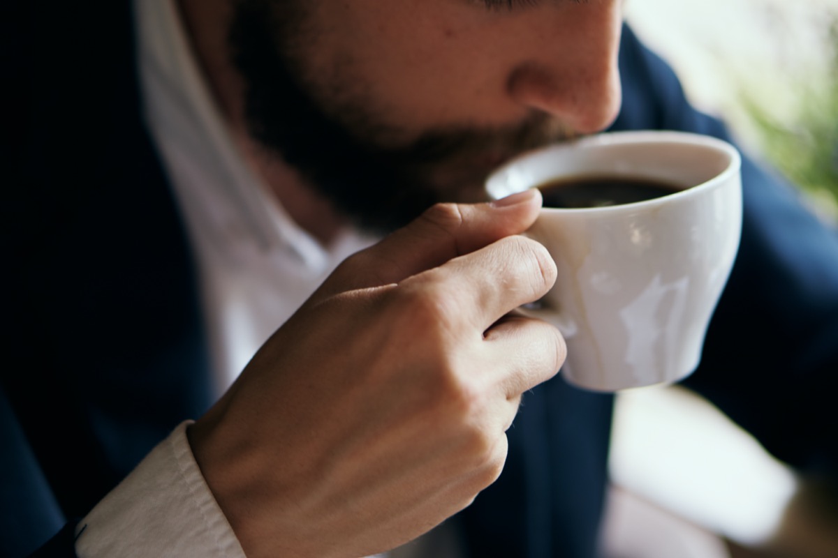 Business man drinking coffee in a cafe