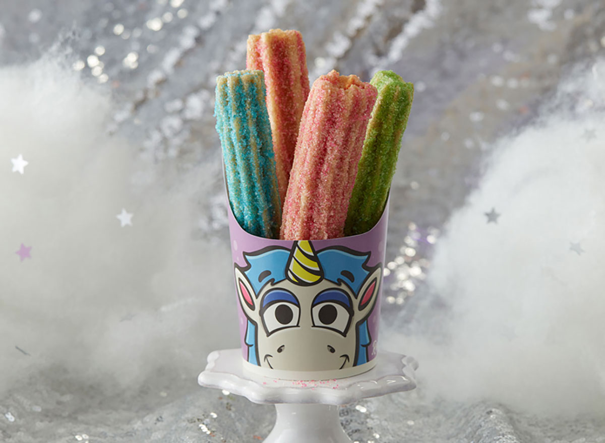 unicorn churros with pink blue and green sugar in serving container