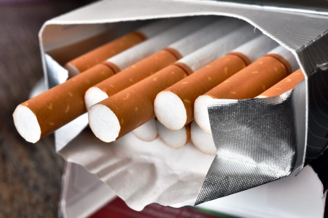 A close up image of an open pack of cigarettes.