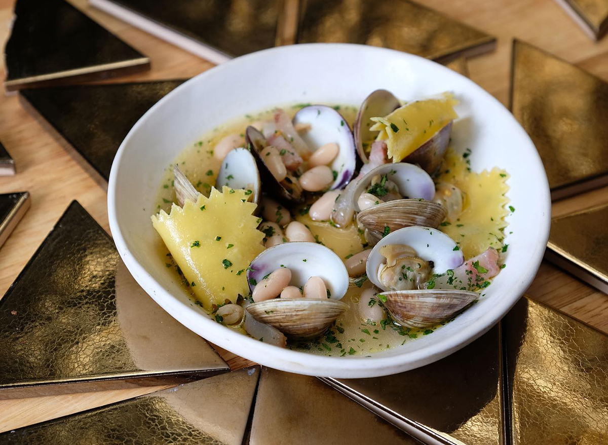 clams and beans with pasta in broth