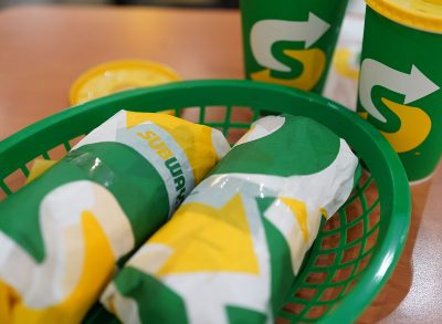 closeup of subway subs with drinks