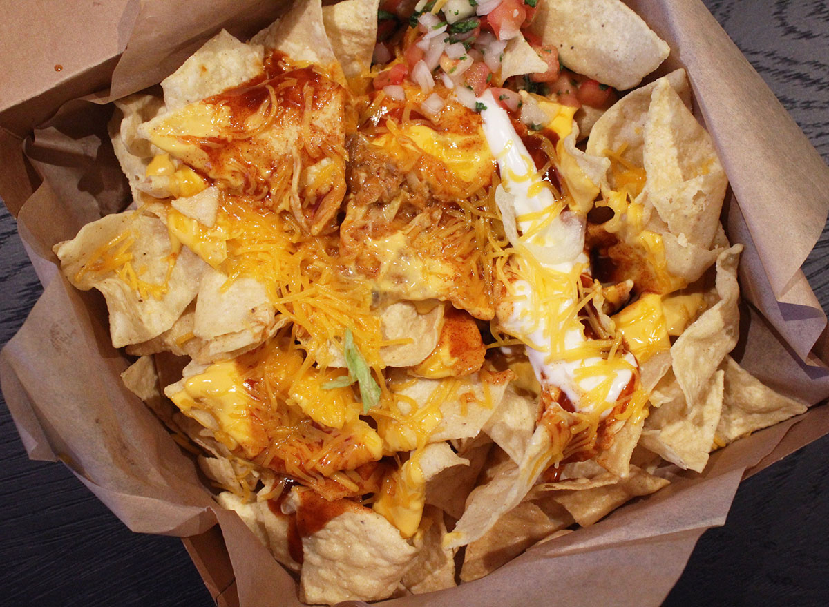 closeup of taco bell cantina chicken enchilada nachos box