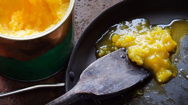 cooking with ghee in a back pan
