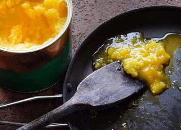 cooking with ghee in a back pan