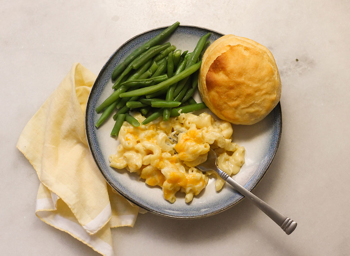 Cracker Barrel mac and cheese with green beans and a biscuit on a plate