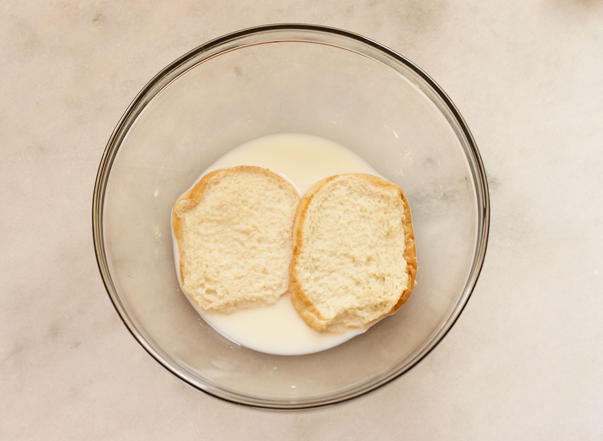 Hamburger bun soaking in milk for meatloaf.