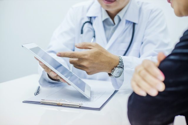 Doctor consultation with the patient by using digital tablet