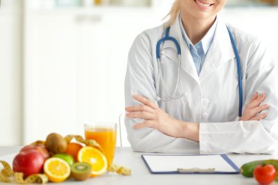 female nutritionist working in her office