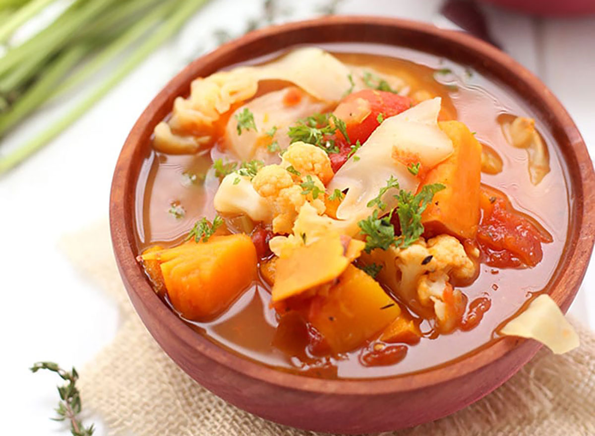 fall vegetable soup with sweet potato and cauliflower in bowl