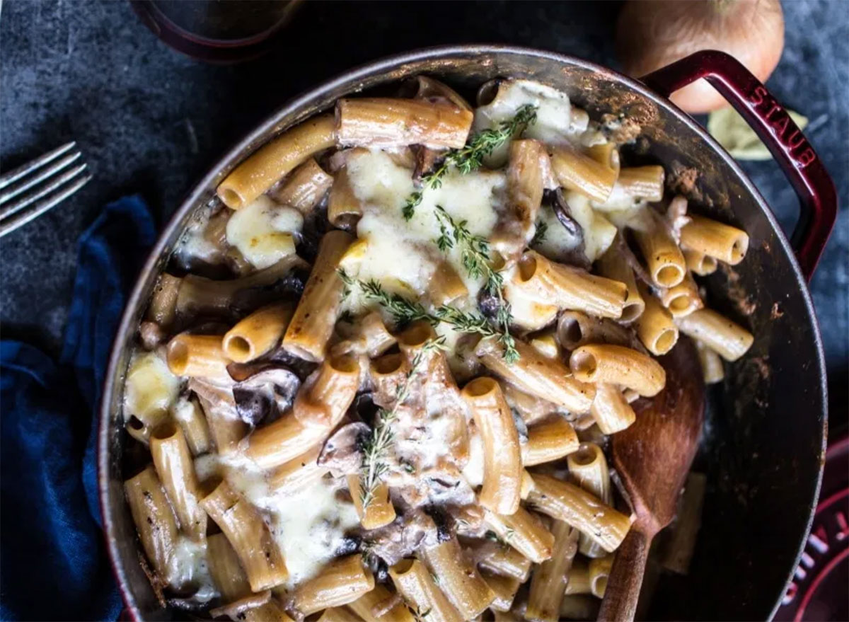 french onion pasta bake with mushrooms and cheese in pan