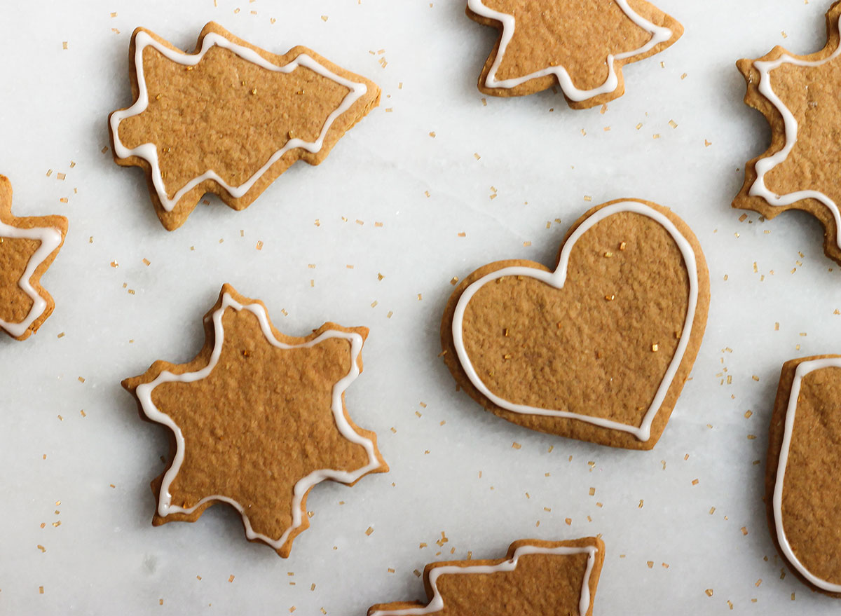 finished gingerbread cookies with edible glitter on a marble counter