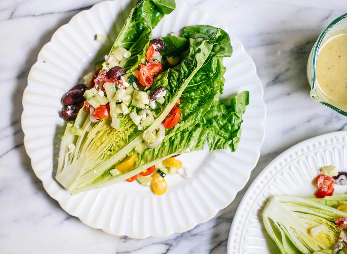 greek wedge salad with romaine lettuce slices tomatoes kalamata olives feta cucumber