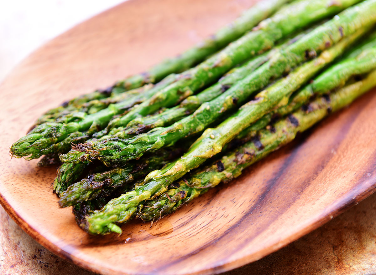 grilled asparagus on wooden surface