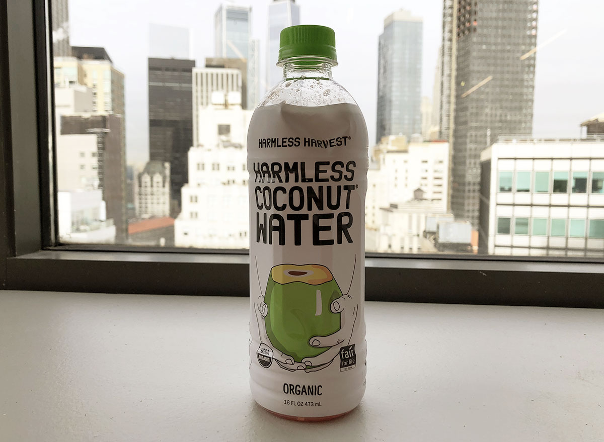 harmless harvest organic harmless coconut water bottle by window