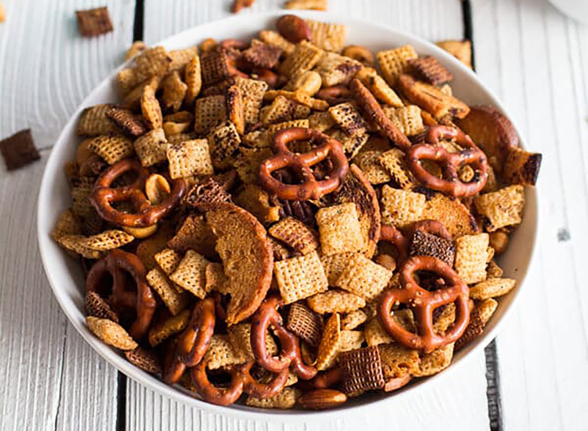 bowl of homemade chex mix with cereal and pretzels