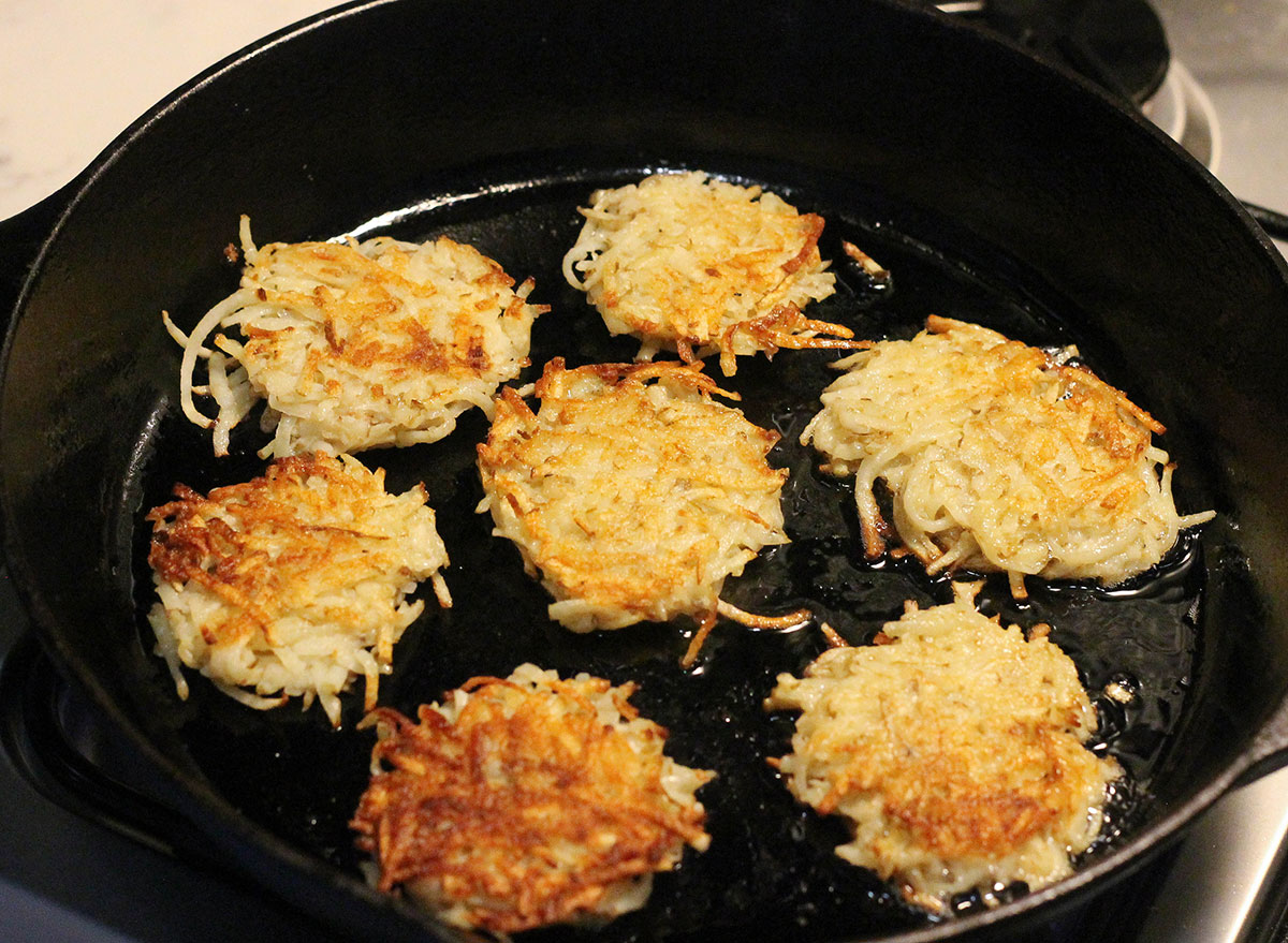 Frying up latkes in a cast iron skillet