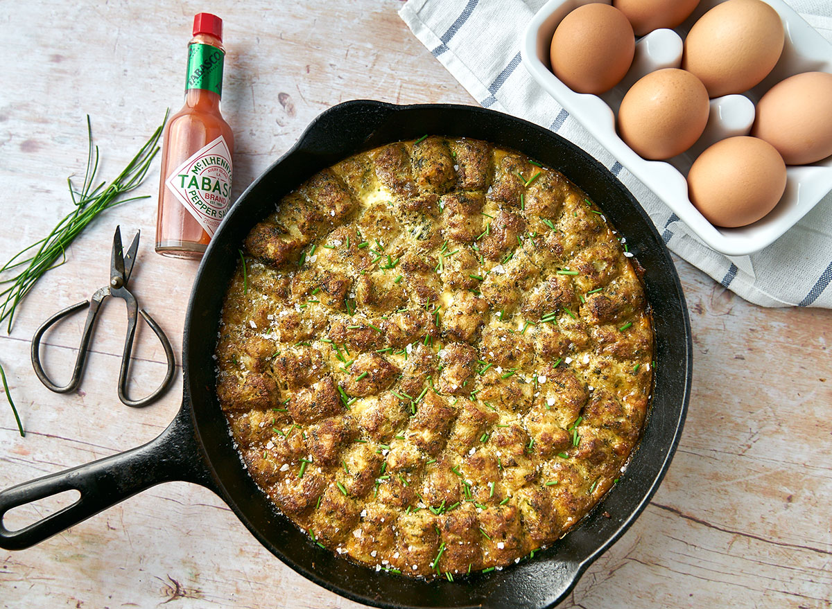 lentil veggie tots hot dish in cast-iron pan with eggs