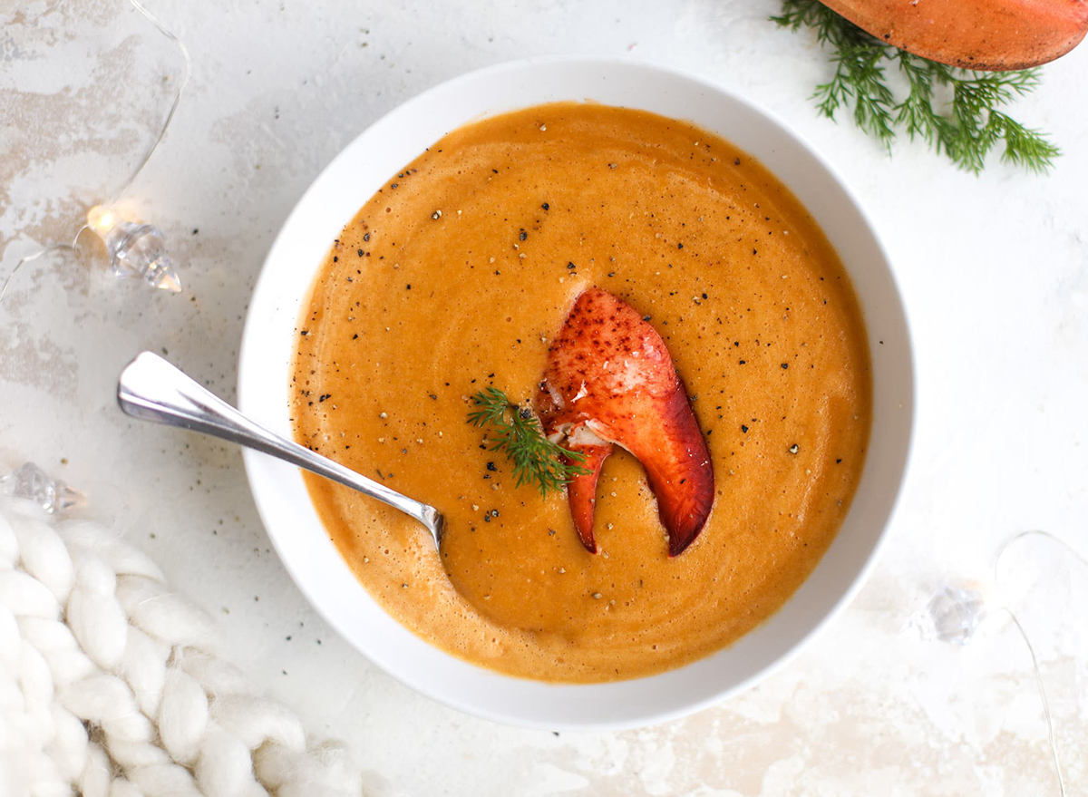bowl of lobster bisque soup with lobster claw