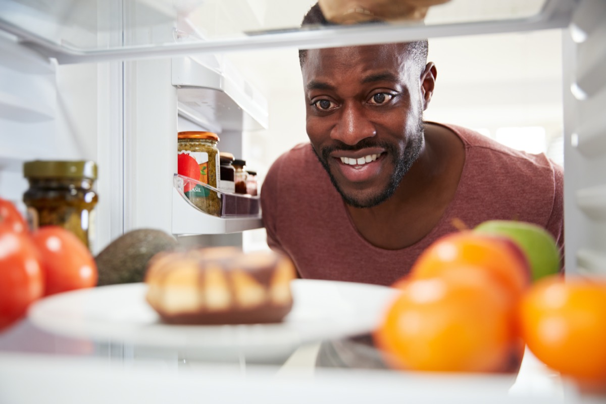 Man Opens Door And Reaches For Unhealthy Donut