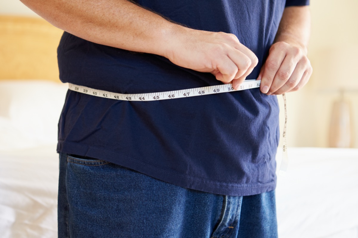 Overweight Man Measuring Waist