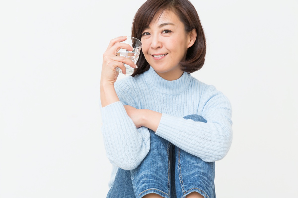 Asian middle age woman who drinks water