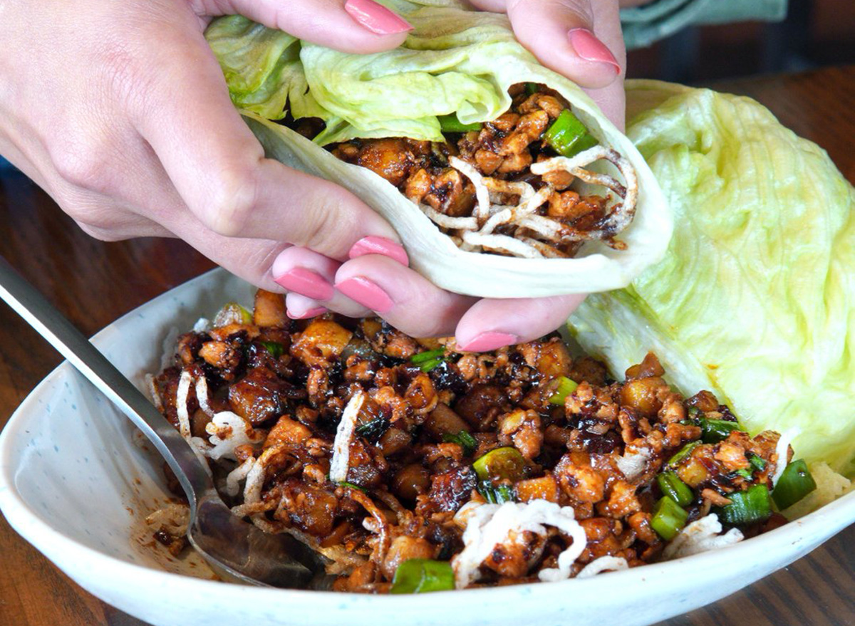 wrapping up a chicken lettuce wrap