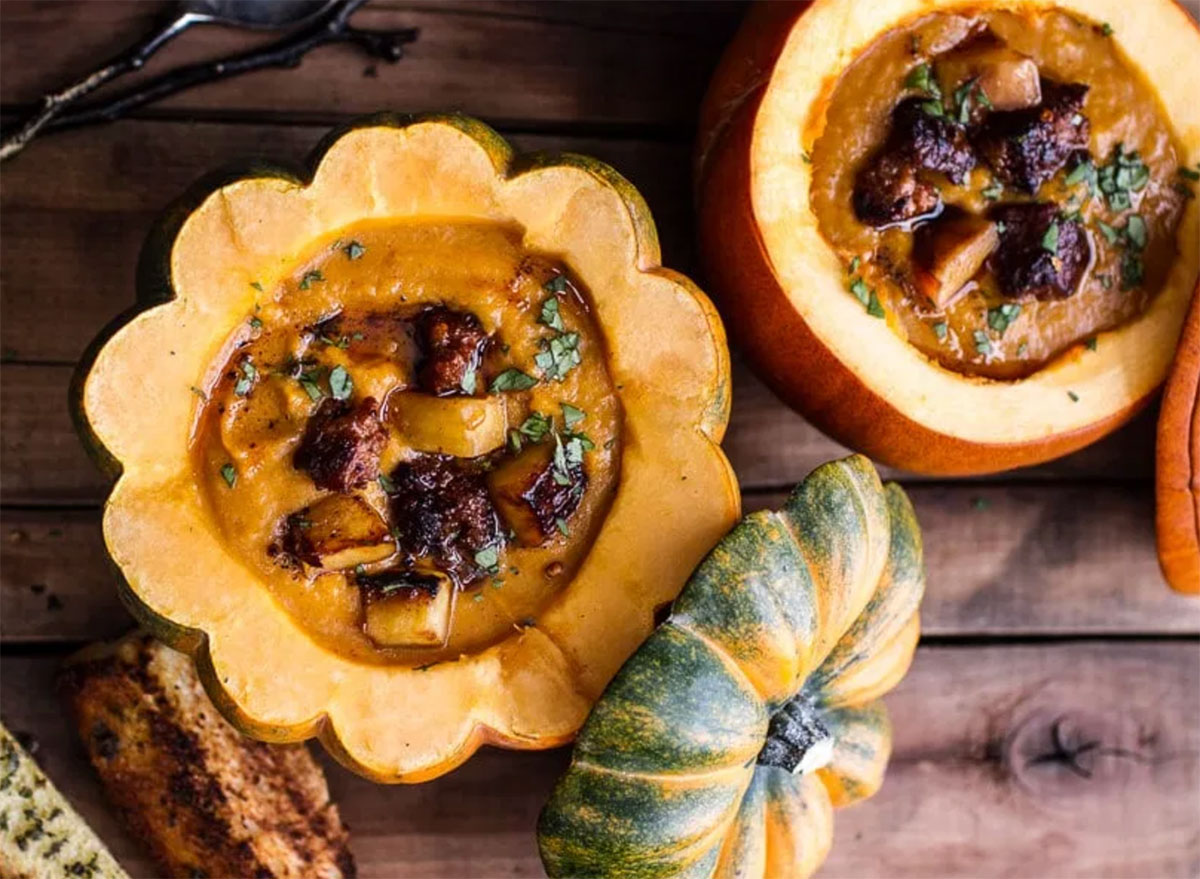 pumpkin chipotle soup served inside sliced squash