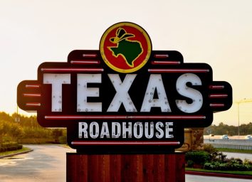 texas roadhouse sign at sunset