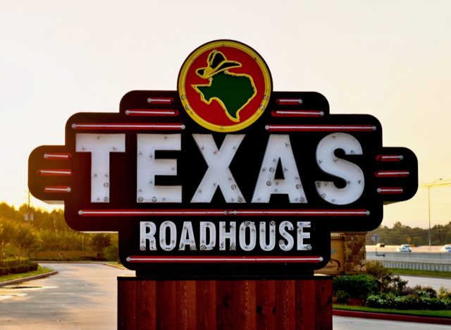 texas roadhouse sign at sunset