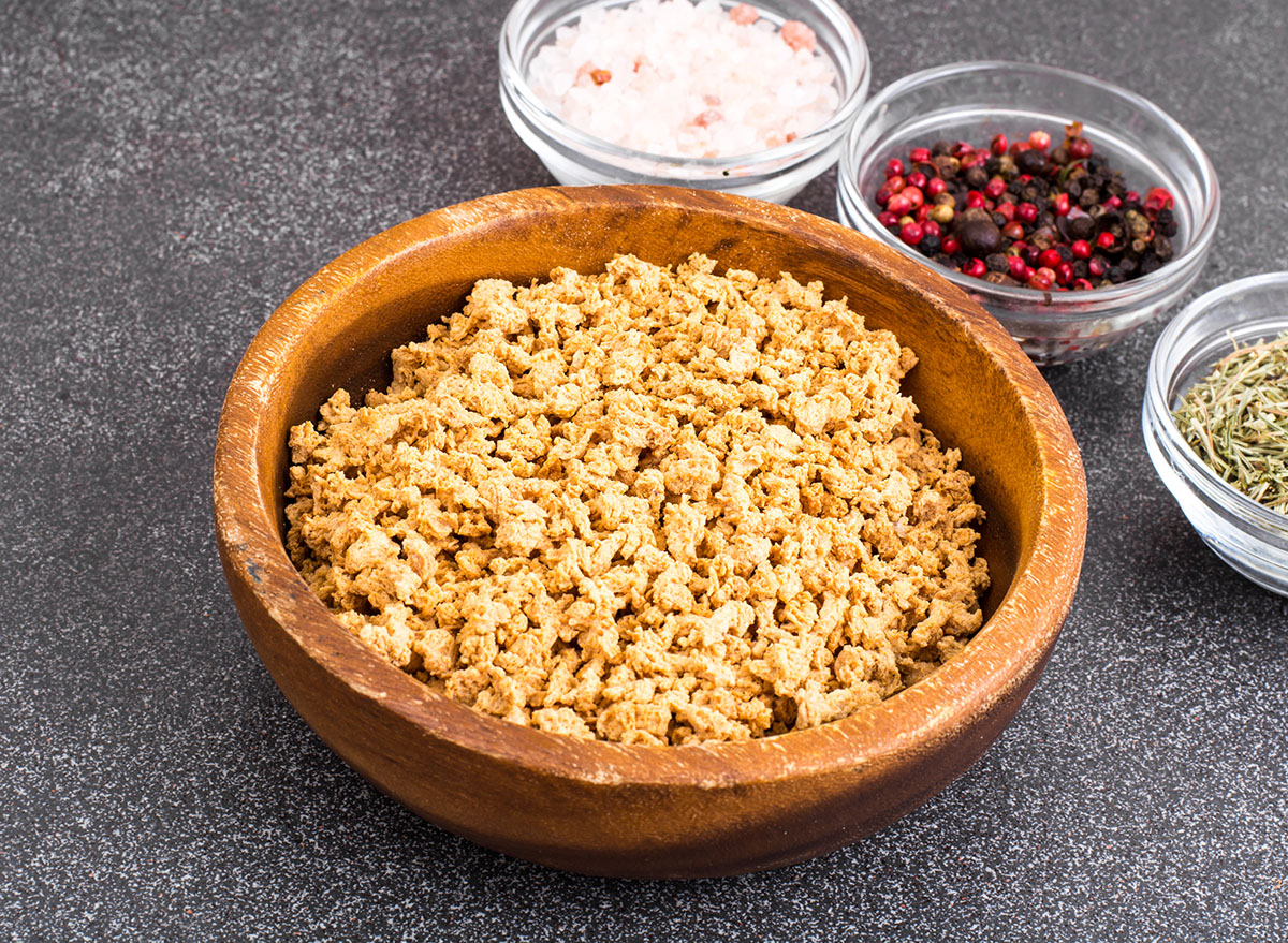 textured vegetable protein in wooden bowl with spices