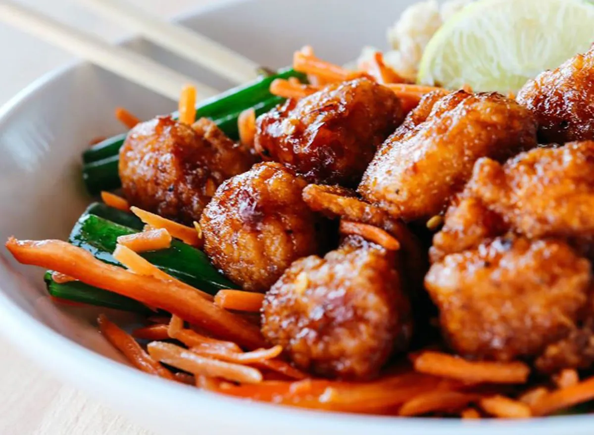 thai dynamite chicken in a bowl with vegetables