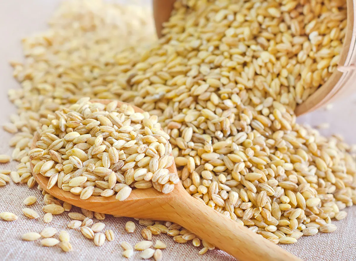 wheat berries in wooden spoon