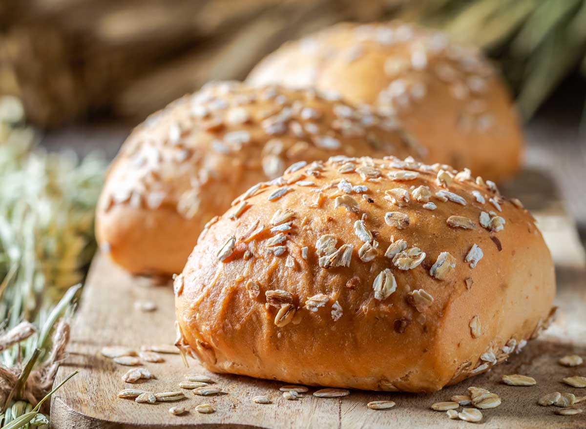 Whole grain dinner roll topped with oats