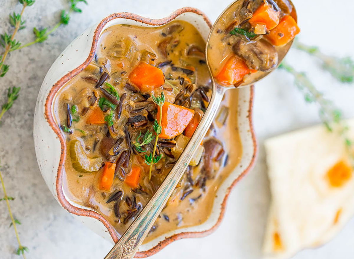 wild rice soup in bowl with spoon