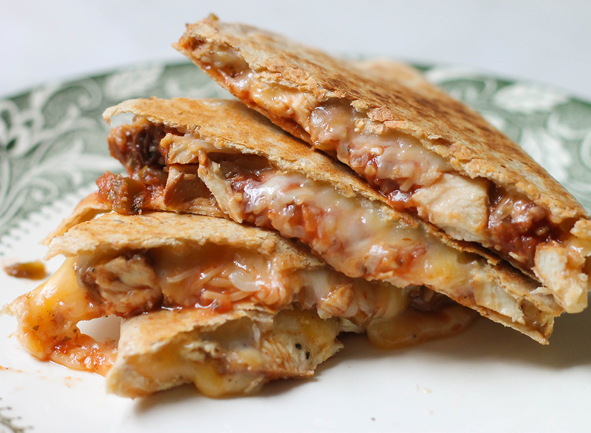 chicken quesadilla quarters stacked together on a plate