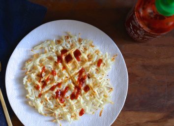 whole 30 parsnip waffle on white plate with sirracha