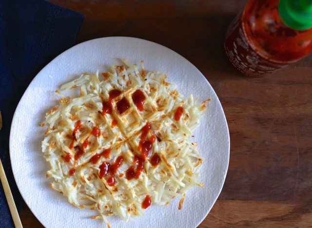 whole 30 parsnip waffle on white plate with sirracha