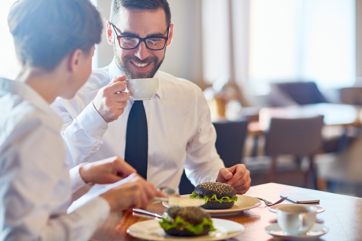 Business people interacting by lunch in restaurant