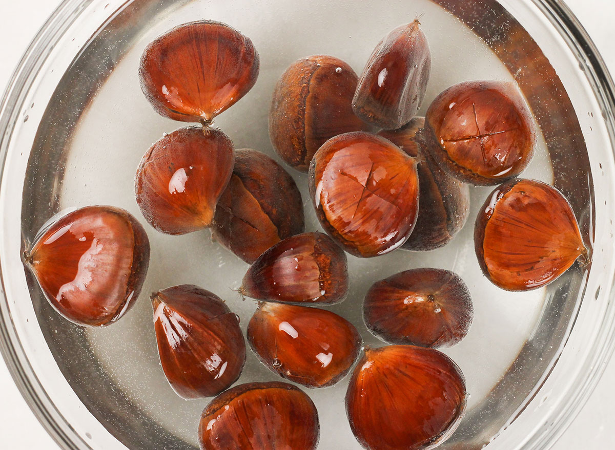 soaking chestnuts in a bowl with hot water