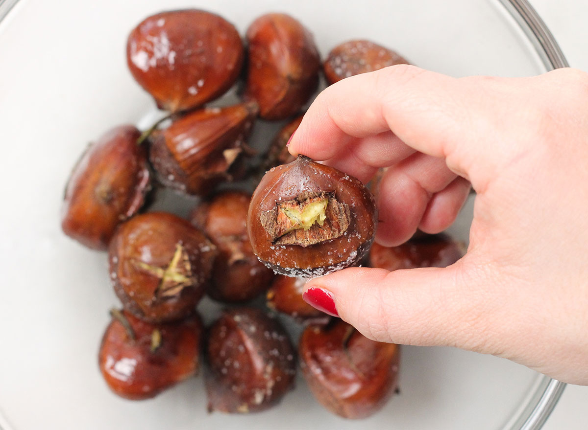 picking up a roasted chestnut