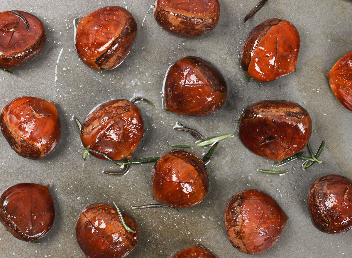 spreading chestnuts on a baking sheet