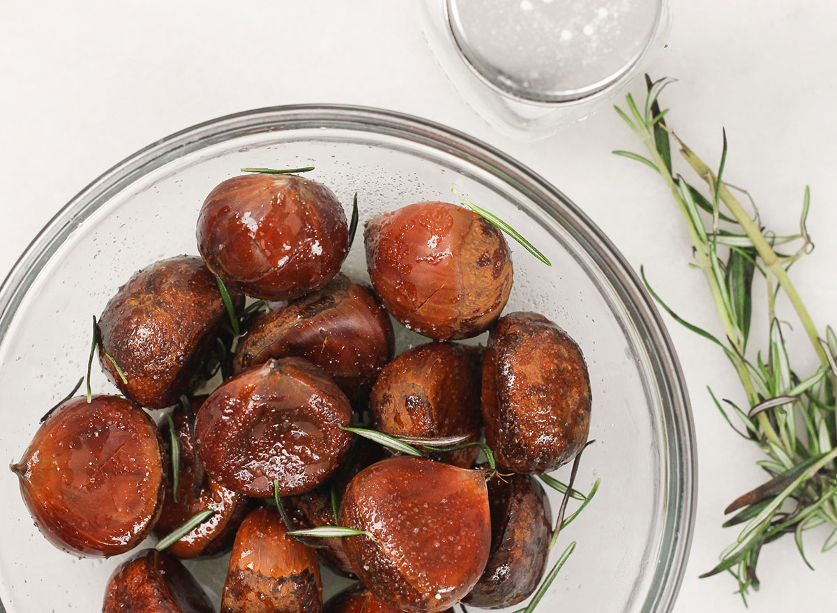 mixing the chestnuts with melted butter salt and rosemary
