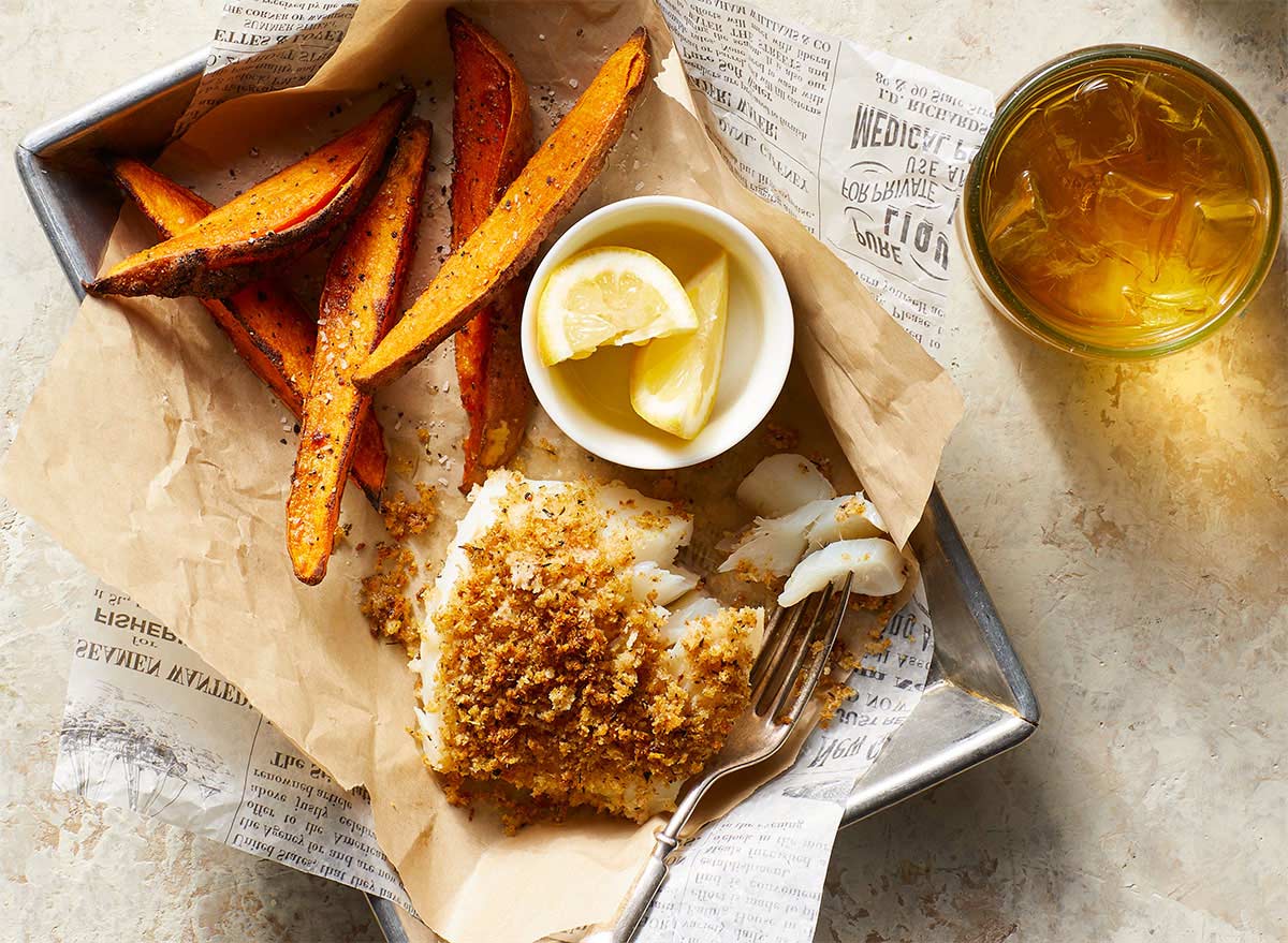 crispy cod with sweet potato fritters in a basket
